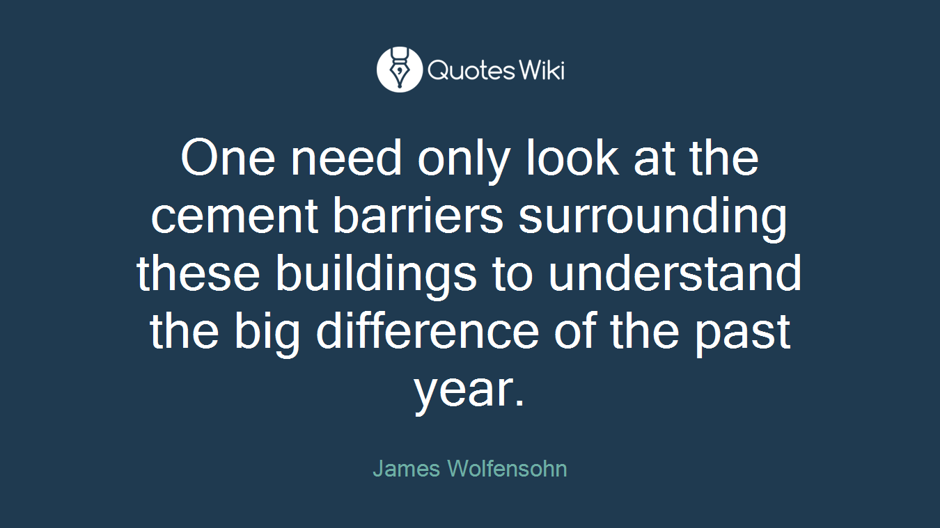 One need only look at the cement barriers surrounding these buildings to understand the big difference of the past year.